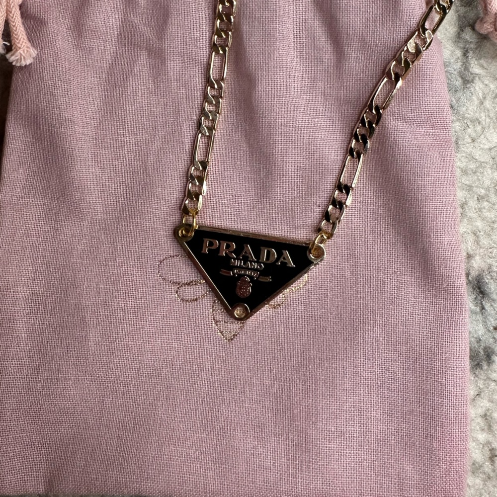 Black and gold Prada necklace